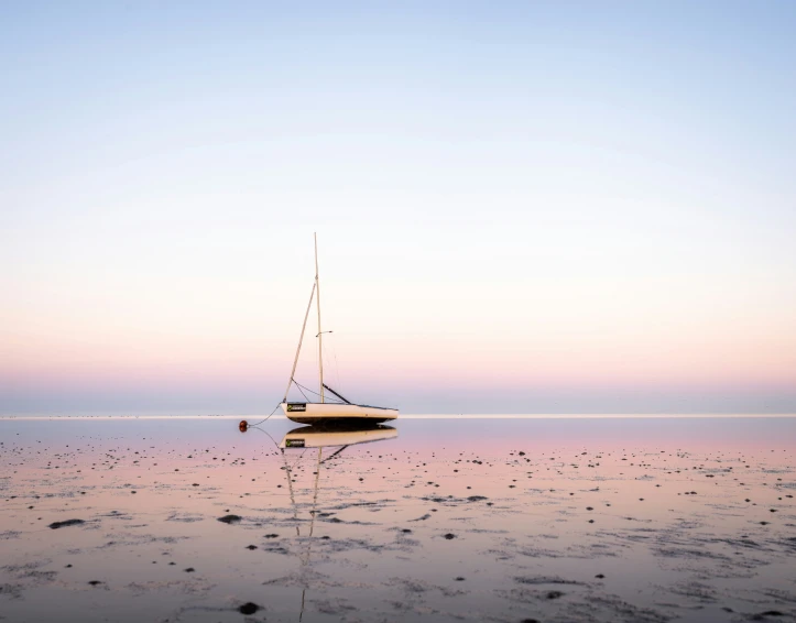 a small boat in the middle of the water