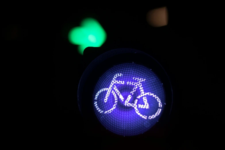 a close up of a blue traffic light