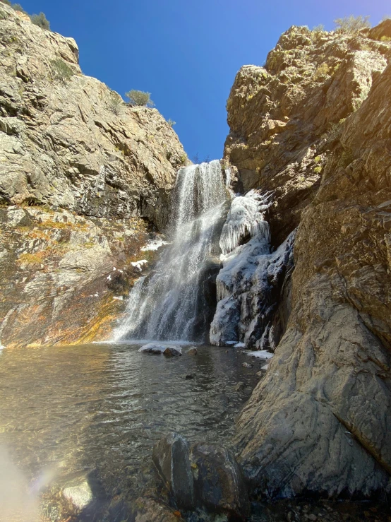 a close - up of water falling off the side of a hill