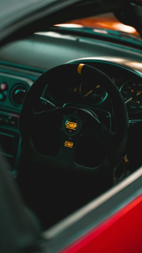 inside view of an automobile with steering wheel in focus