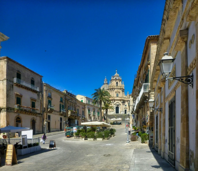 a street in a small town has lots of buildings