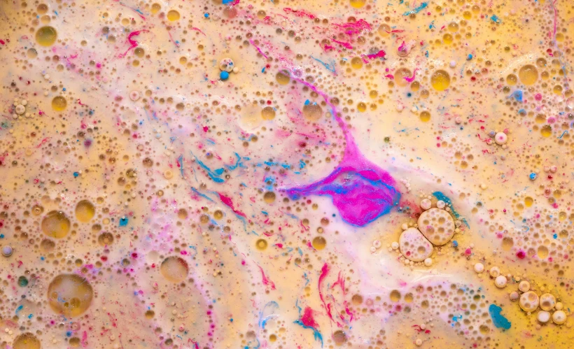 lots of colors and bubbles on a dirty surface