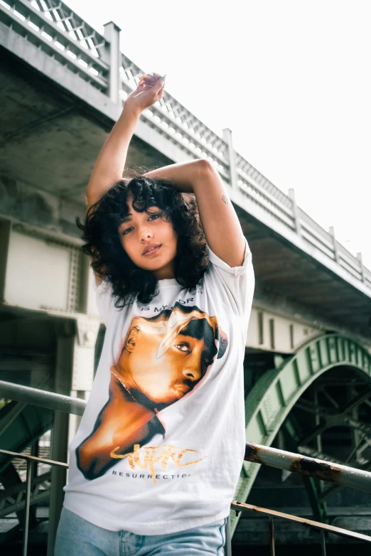 the young woman is posing with her hair hanging out