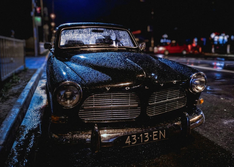 a close up of the headlights of a black vintage car