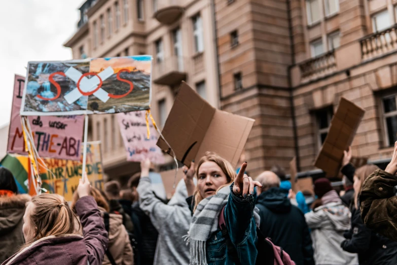 people protesting in front of a building during a protest