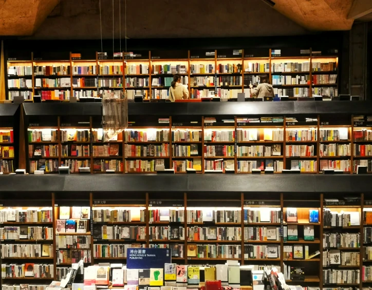 a very long room filled with lots of books