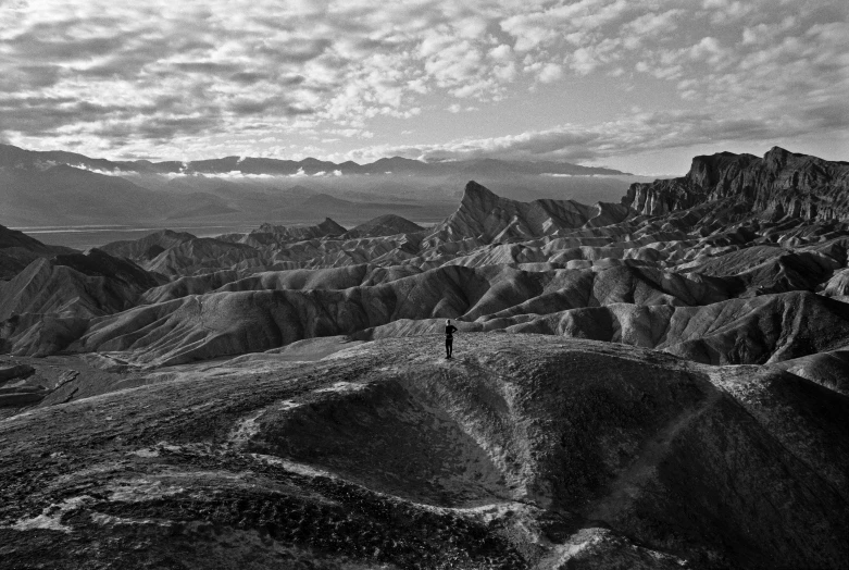 the man is walking alone on the mountain