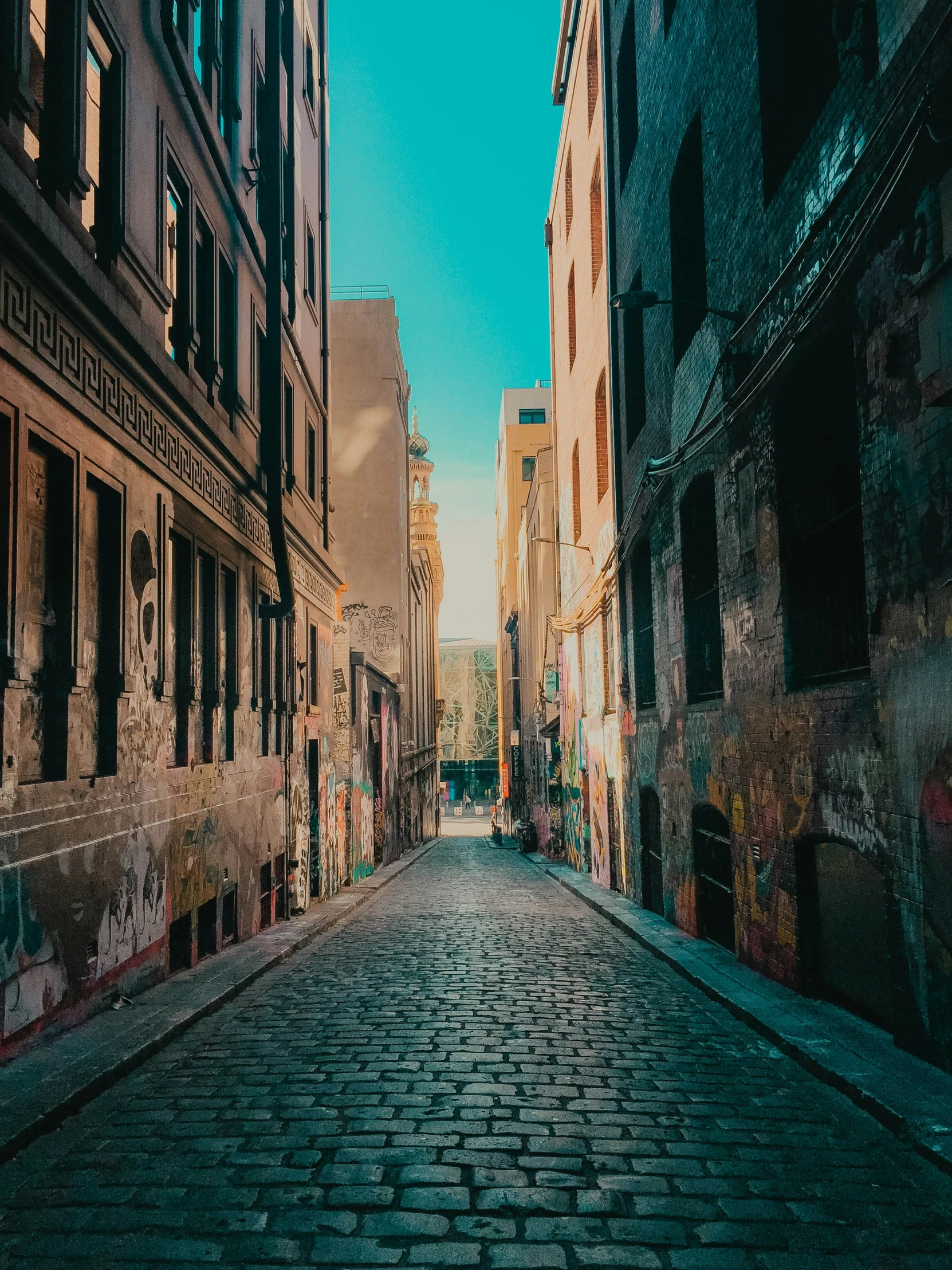 an old brick road is paved with a sky background