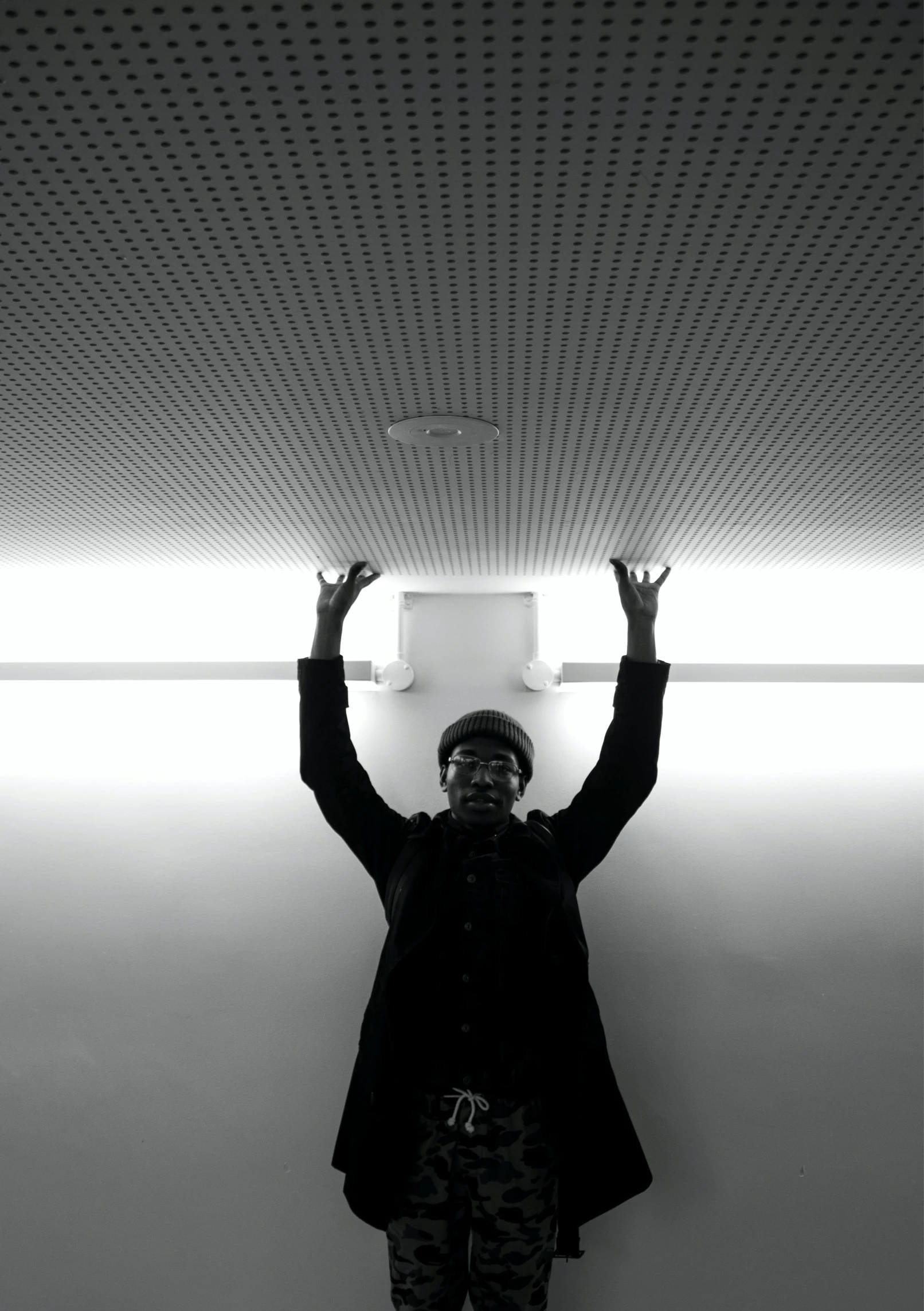 a person is standing under the canopy of a ceiling