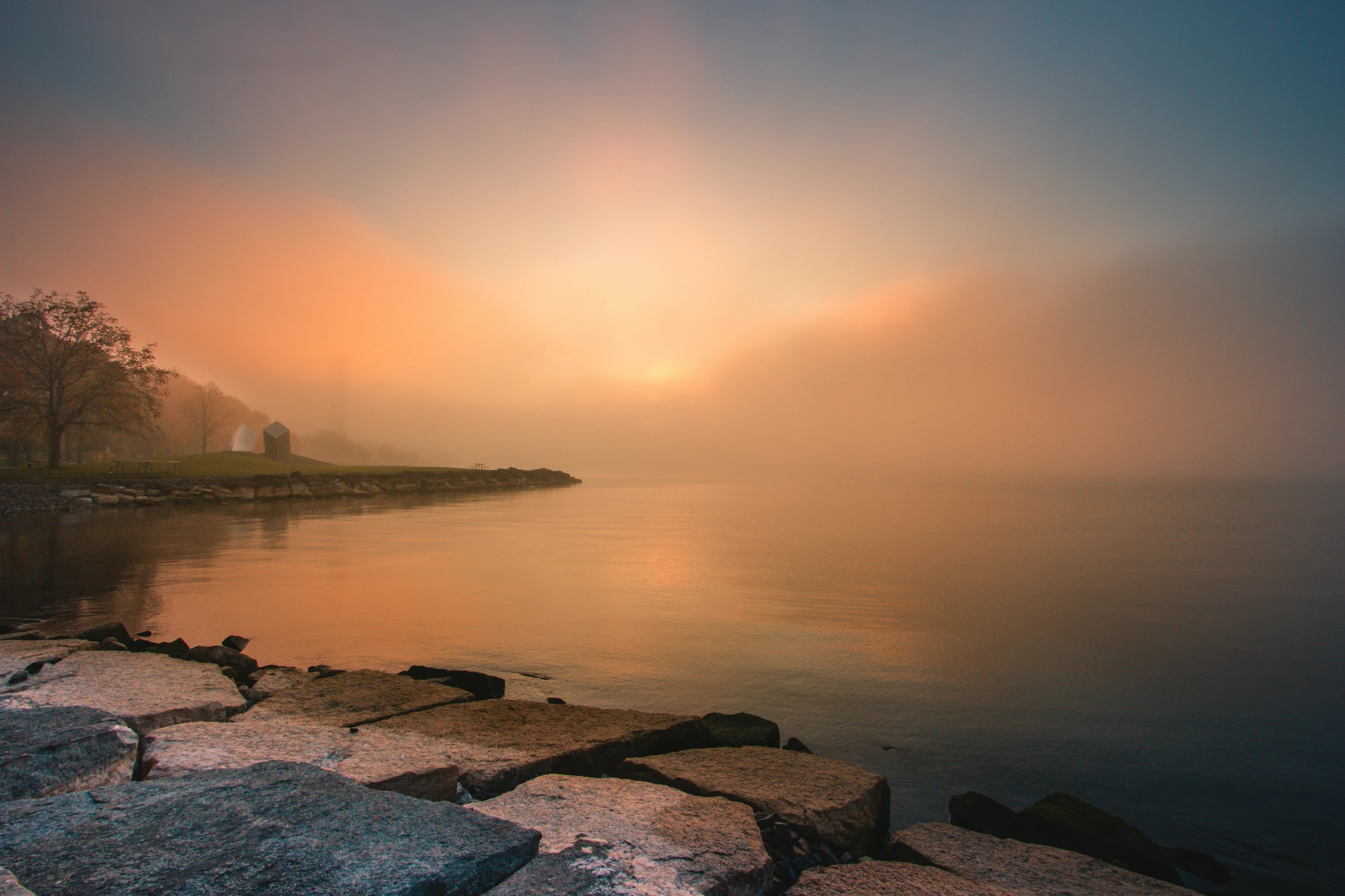 an image of a boat in the water at sunset