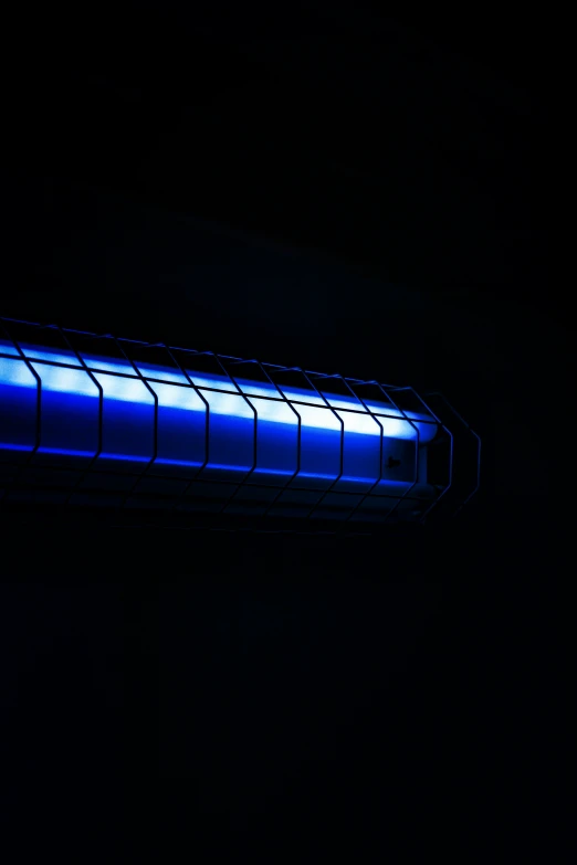 a very big bright blue tube in the dark