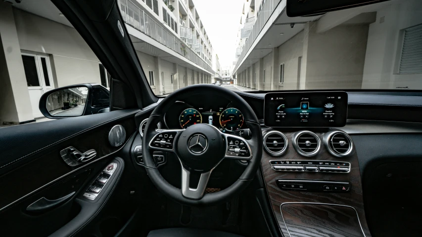 interior view of the dashboard and dash with a clock and various electronic devices