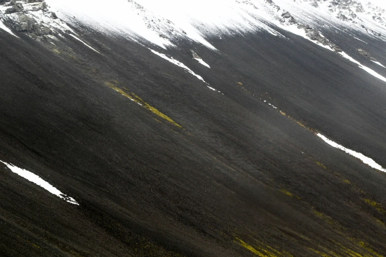 a snow covered mountain is shown with yellow lines on the snow