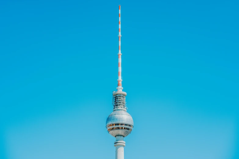 the television tower in berlin germany against a blue sky