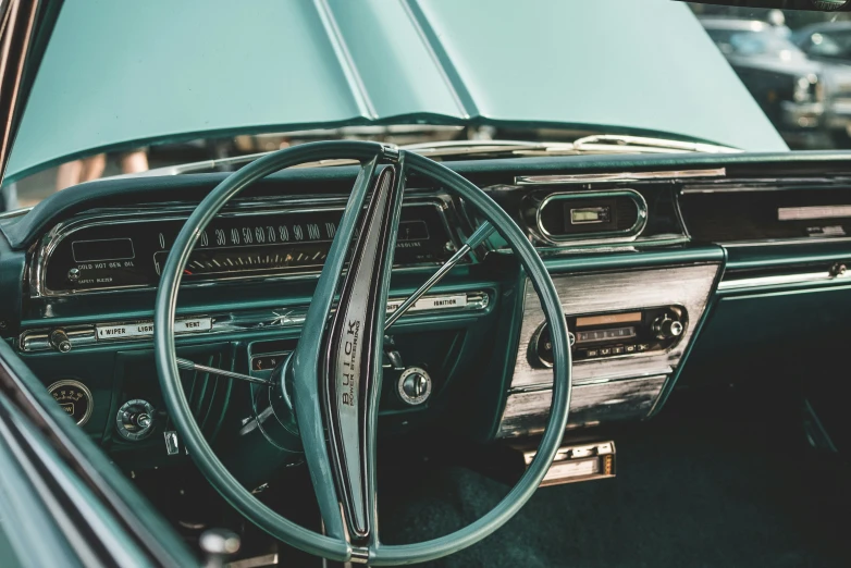 a green car dashboard and a steering wheel