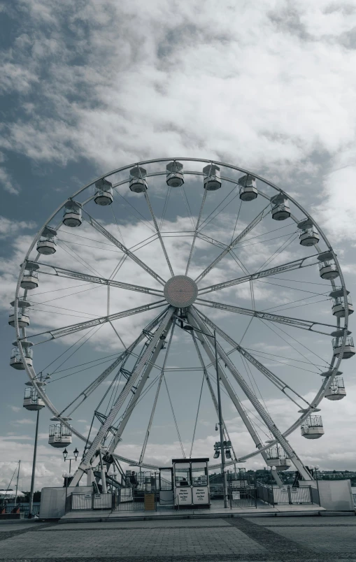 a big ferris wheel sitting on top of a field