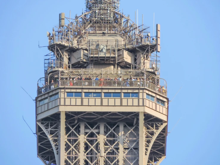 the clock is visible against the blue sky