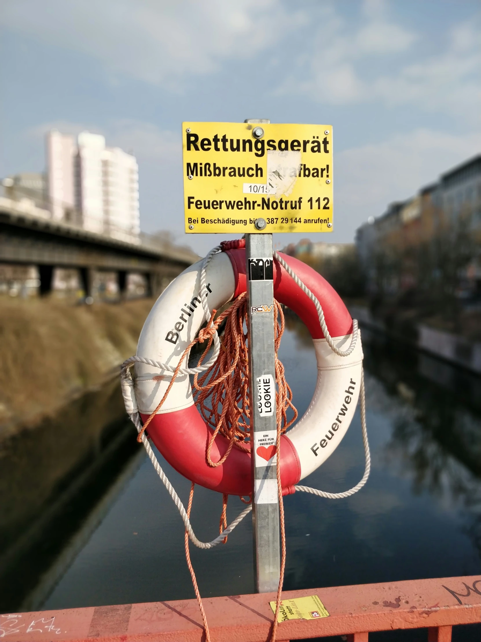 a raft is tied to a pole near water