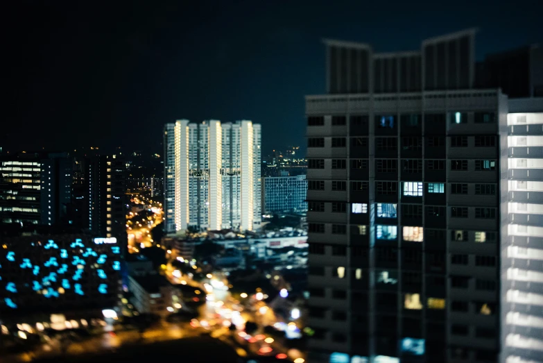 city buildings are at night with many street lights
