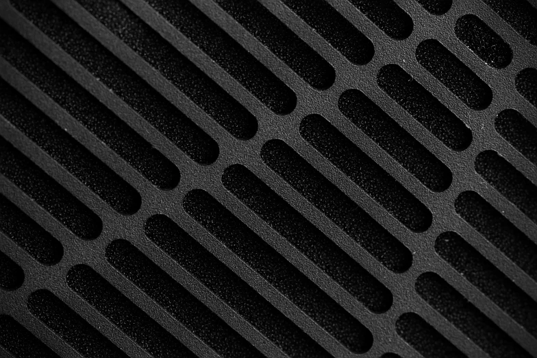 black grills made of black plastic in a dark room