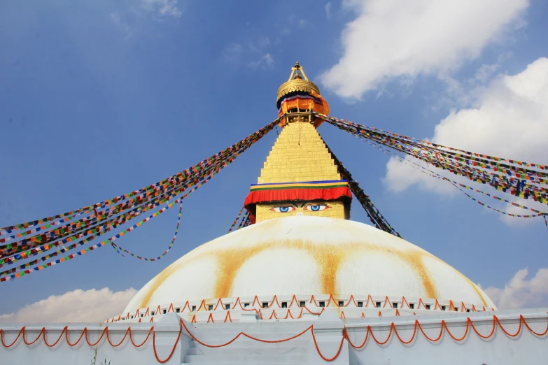 a view of the top of a large building under blue skies