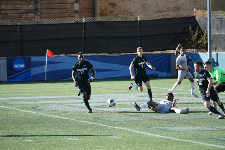 two soccer teams in action on the field