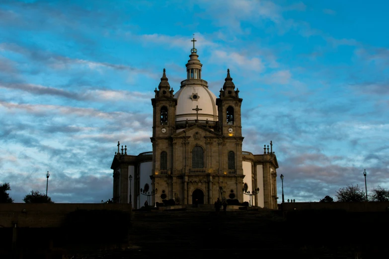 the big cathedral is up against a clear sky