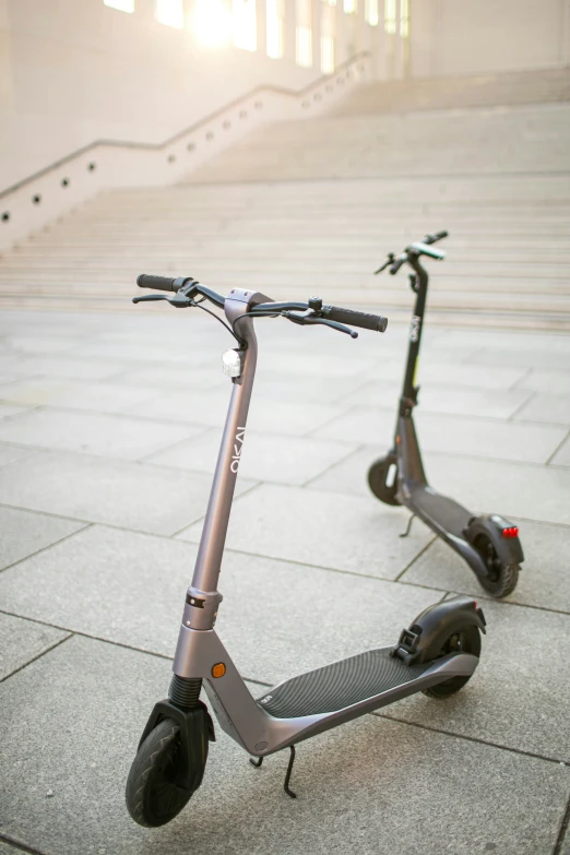 two scooters are sitting near the steps