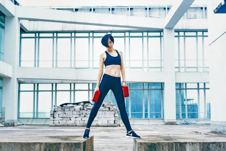 the young woman is posing with her red purse