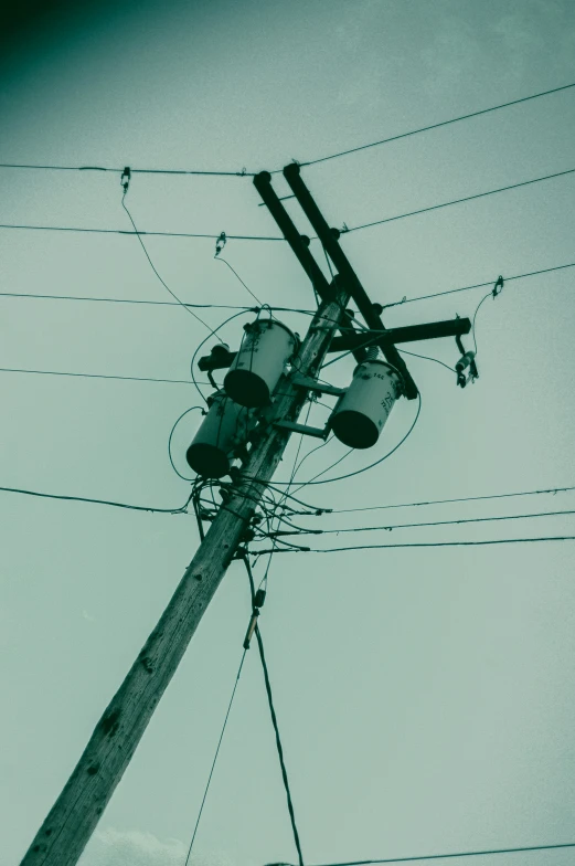 electric power lines and power pole with wires across the s