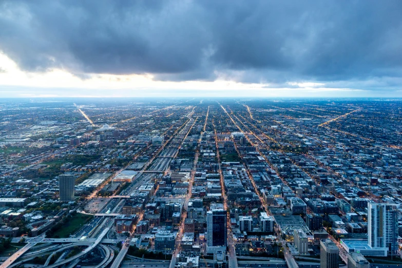 a wide s of a city under storm clouds