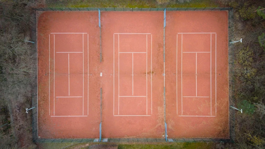 aerial s of a tennis court with lines cut out