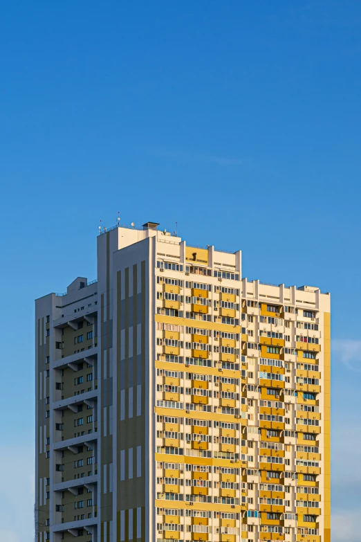 an airplane that is flying in the air by some buildings