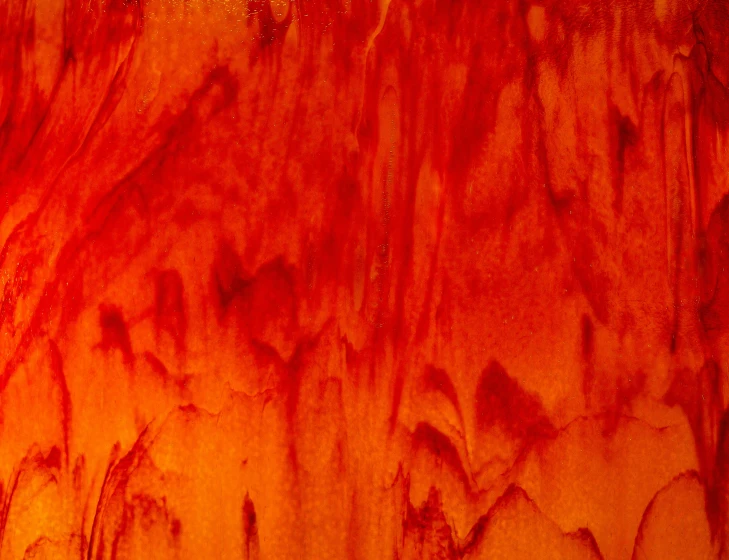 close up view of red stain on wood panel