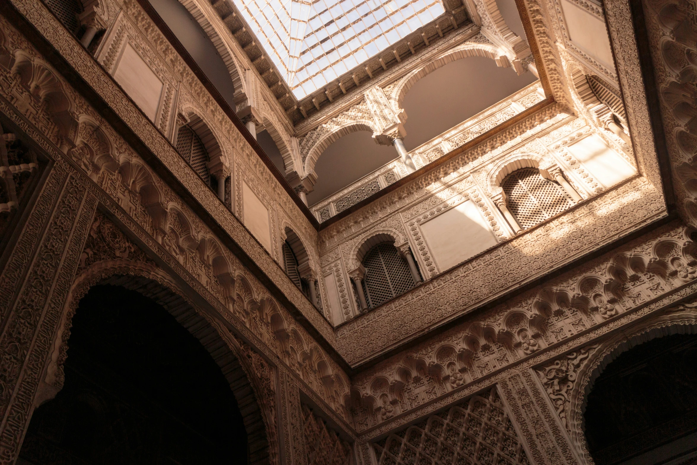 an intricately decorated building features a skylight and windows