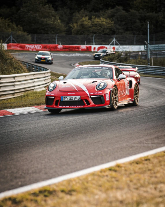 a race car making a right turn on a track