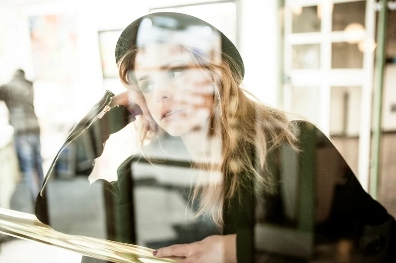 a person is seen through a glass window