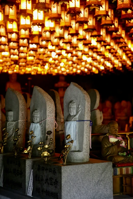 a display with buddha statues on cement blocks