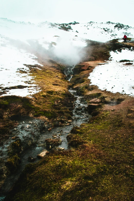 there is snow on the ground, and some people