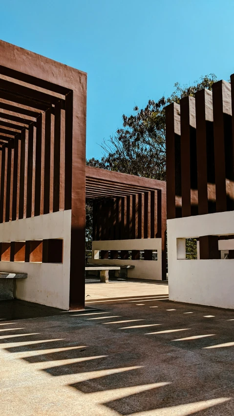 two structures designed to resemble wooden slats