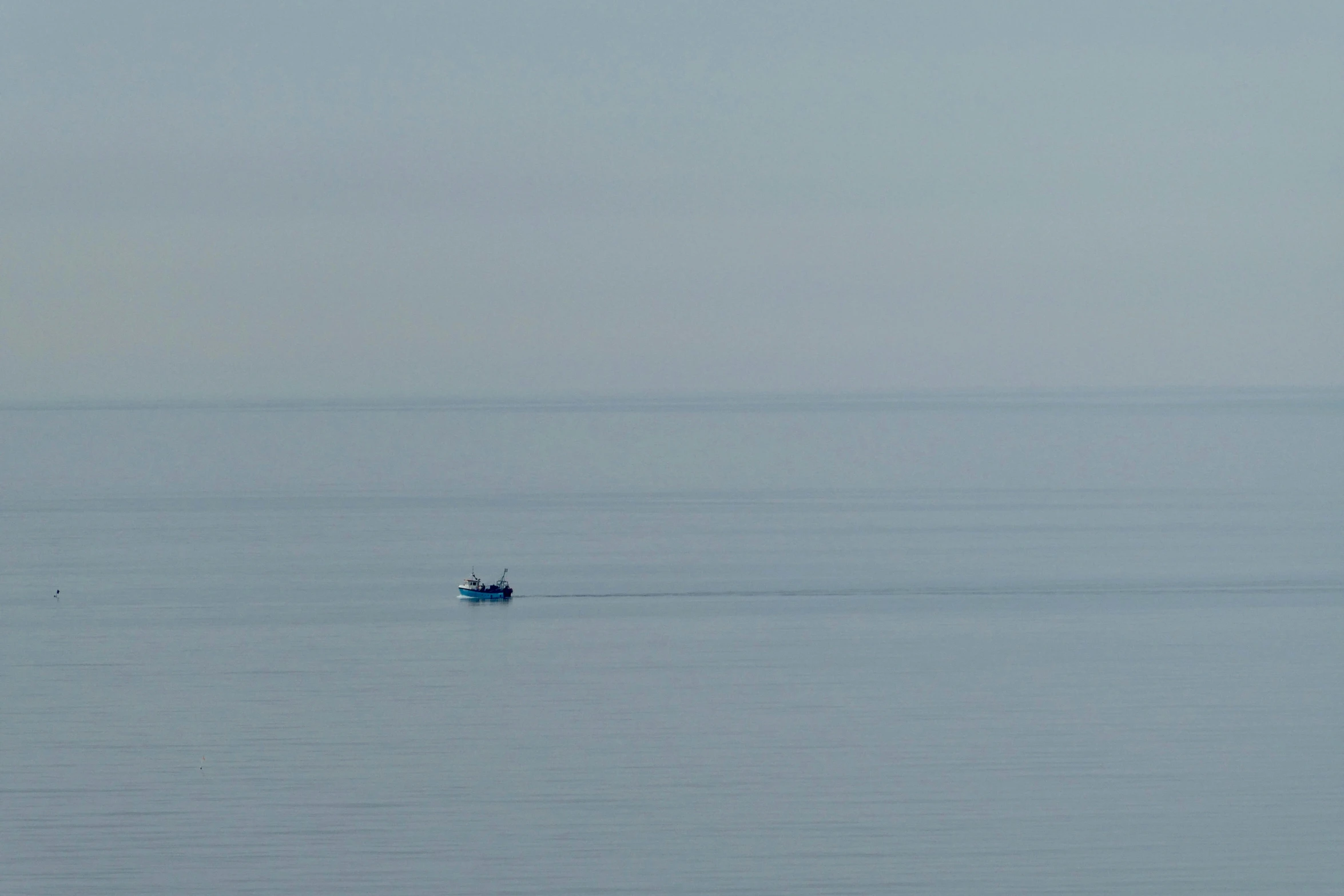 an image of a boat in the water with no one on it