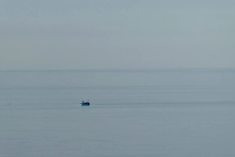 an image of a boat in the water with no one on it