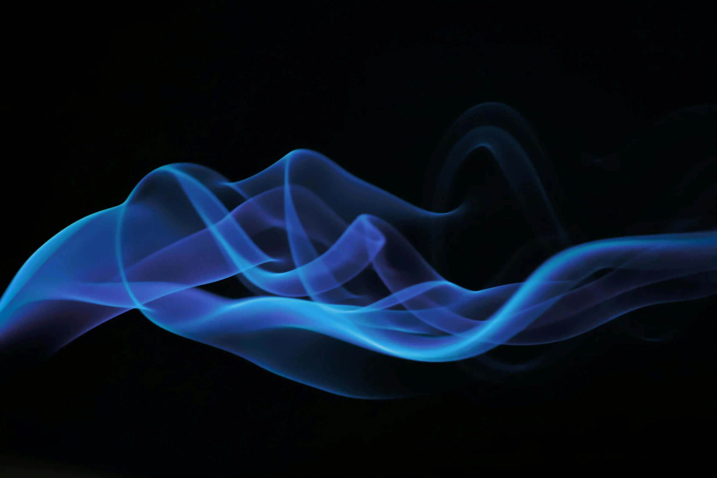 the smoke is blue and the black background has some waves in it