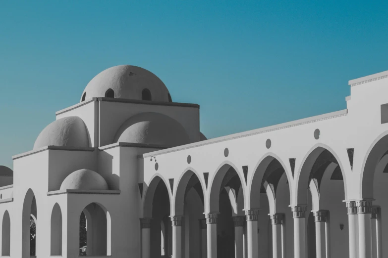 the building has a lot of arches on the roof