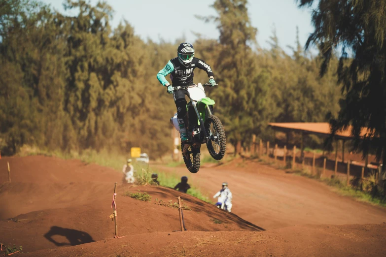 a man riding on the back of a dirt bike