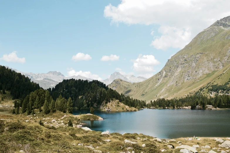 a view of a lake and mountains in the background