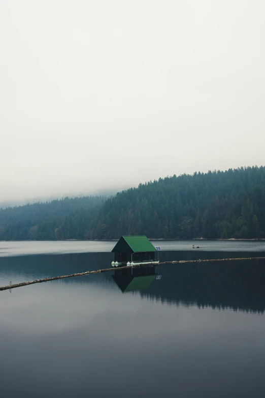 a boat is sitting on a lake by itself