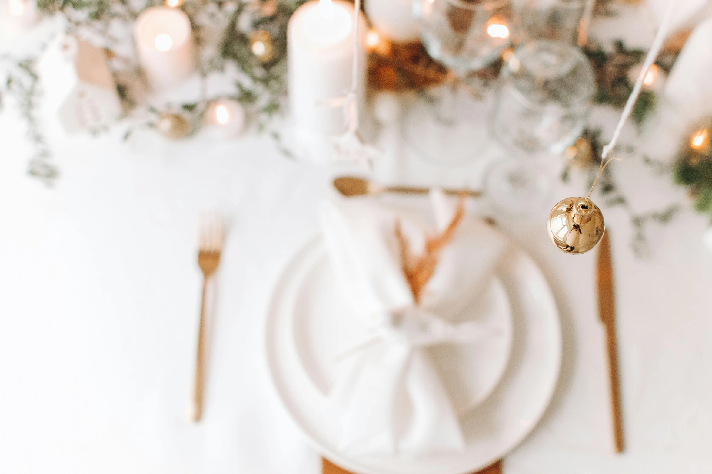 the table is decorated with pink roses and a napkin