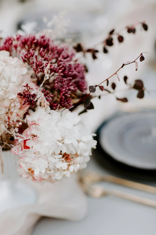 flowers that are inside of a vase on the table