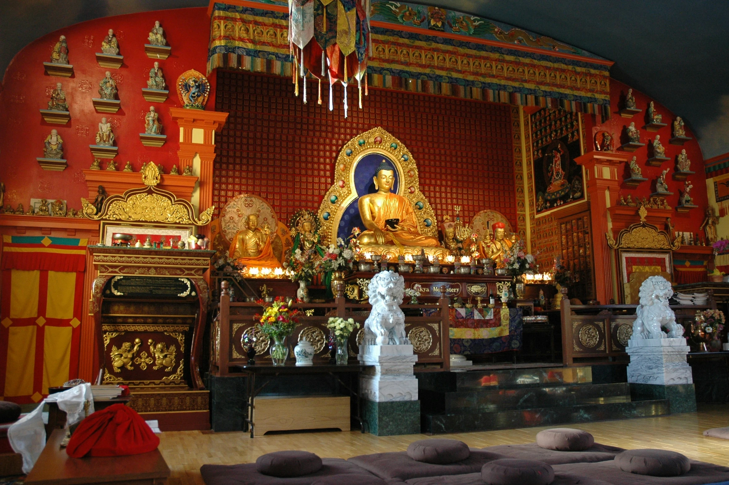 a colorful and decorated temple with white statues